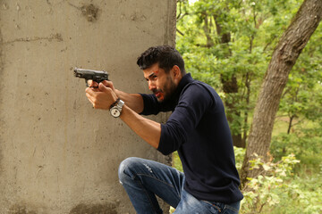 A man with a pistol in his hands