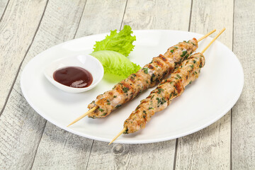 Minced pork skewer kebab with sauce
