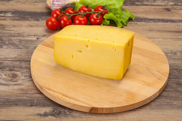 Hard yellow tasty cheese brick