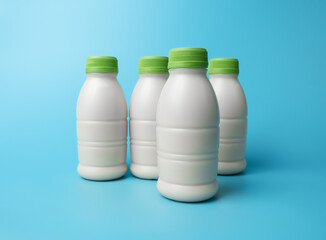 Bottle of milk on blue color background.