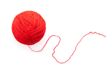 Red ball with woolen threads isolated on white background