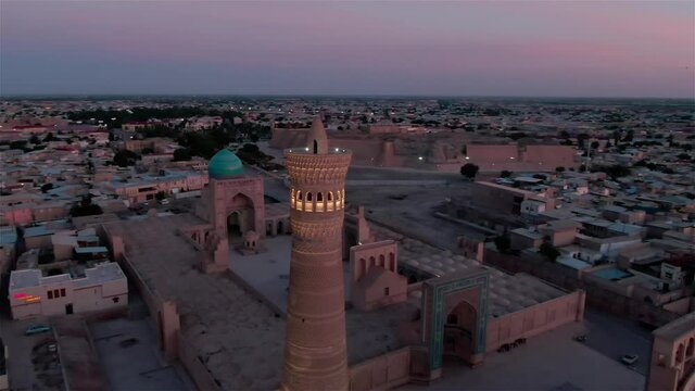 Panorama of old Bukhara (ancient city in Uzbekistan) and Kalyan Minaret in the evening, shot by a drone