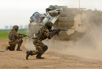 Military conflict zone. The soldiers are fighting.
