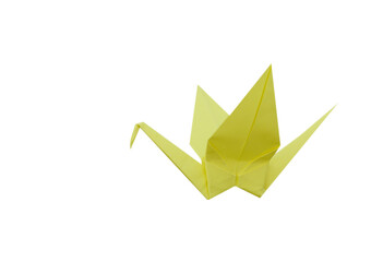 A yellow origami Crane isolated white