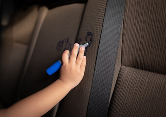 Children drawing with marker pen on the car backseats