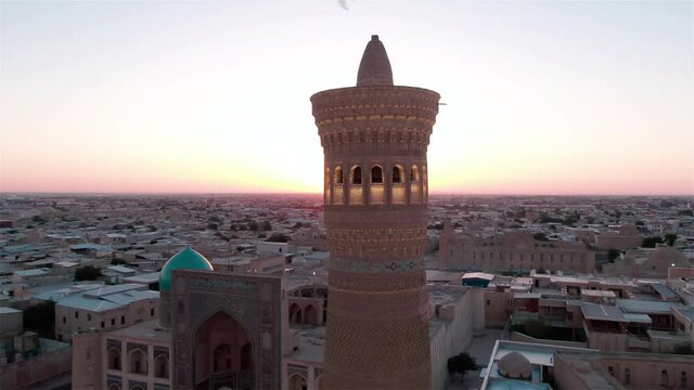 Po-i-Kalyan mosque complex in Bukhara and Kalyan Minaret at sunset, shot by a drone