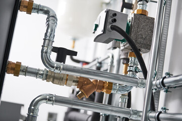 Pump, controller and steel pipeline in boiler room
