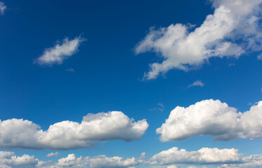 Fototapeta na wymiar Gray clouds on blue sky background.