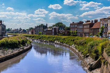 Obraz premium A view southward down the River Nene in Wisbech, Cambridgeshire in the summertime