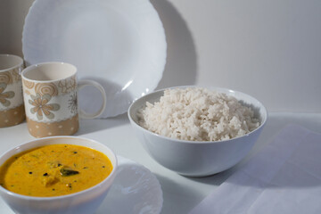 White rice with delicious south Indian style mango curry, white background
