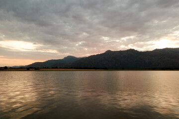Sunset in the Santillana Reservoir with La Pedriza and the Sierra de Guadarrama in the background. Madrid's community. Spain