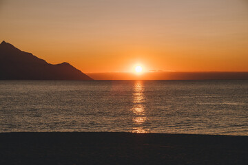 Naklejka na ściany i meble Beautiful morning sunrise at the empty beach