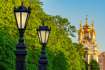 Fototapeta na wymiar Lanterns and trees near the Church. Saint Petersburg. Russia. Pushkin town. Church Of The Resurrection. Orthodoxy. Christianity. Church of the Catherine Palace. Tsarskoe Selo in the Leningrad region.