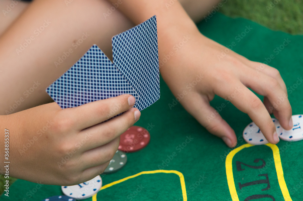 Wall mural man with two poker game cards