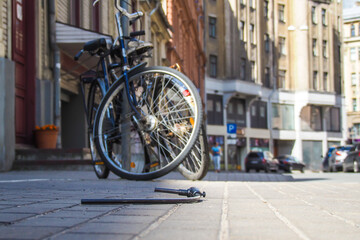 Fototapeta na wymiar Bicycle theft. Folded bicycle lock. Stolen bicycle
