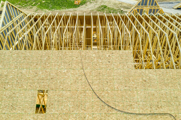 Aerial view of making of a roof with wooden sheating, rafters