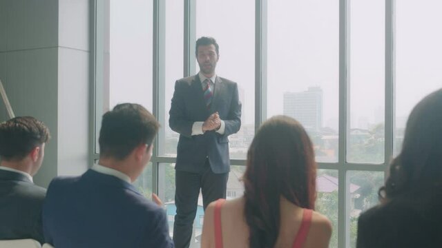 Business group seminar with leader in the office, executive presentation and meeting collaboration, teamwork and success, workshop for learning about career, business startup, communication concept.