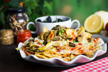 Seafood pasta with mussels and parmesan cheese on a plate