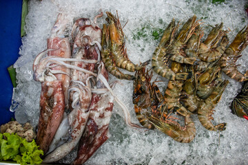 Raw Seafood preserved in ice bucket for customers in a fancy restaurant during the vacation in Bali