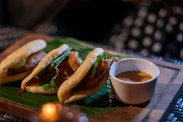 Traditional indonesian food served in a taco bread with stuffed fill in chicken and sauce