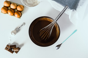 A bowl of cake mix on a white background