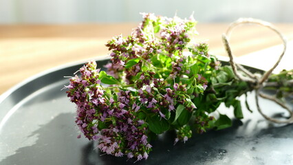 oregano bouquet liying on the table, marjoram bouquet
