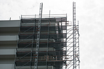 large tall building with scaffolding being renovated