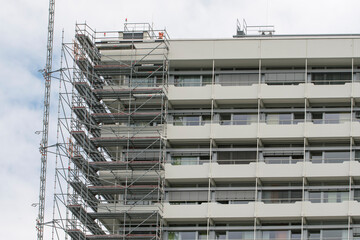 large tall building with scaffolding being renovated
