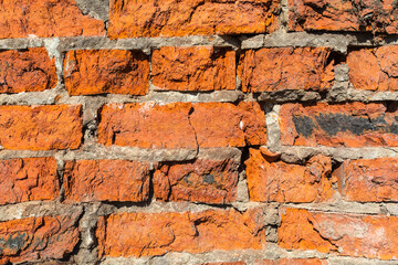 old chipped wall red brick
