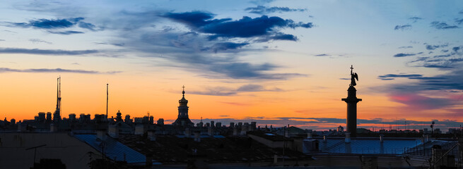 Saint Petersburg, Russia. Roofs of the ancient city at sunset, Alexander Column, Hermitage, colorful sky, panoramic view