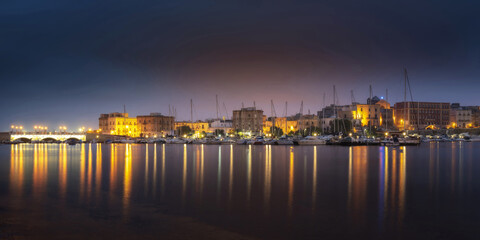 Fototapeta na wymiar Lights of the seaside town. South of Italy.