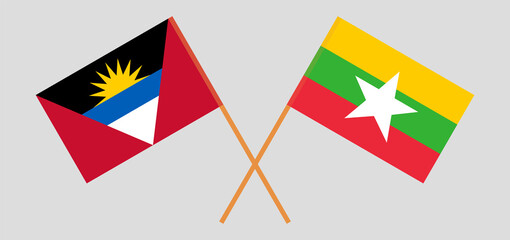 Crossed flags of Antigua and Barbuda and Myanmar