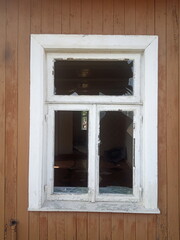 Old window frame in old wooden house
