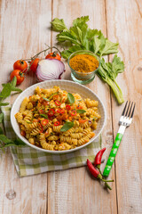 Fototapeta na wymiar pasta with chicken ragout and curry spice