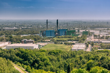 Fototapeta na wymiar View from top of Halde Hoheward to industrial district - Recklinghausen, NRW, Germany