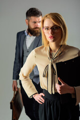 School. Sensual teacher in glasses. Education. School job. Portrait of female teacher with notepad. Bearded teacher. Two teachers standing. Selective focus.