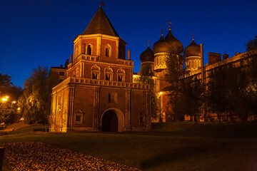 Fototapeta na wymiar The Bridge Tower and the Intercession Cathedral with building light at night in the Izmaylovo Manor in Moscow, Russia
