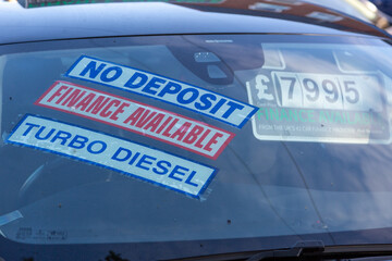 the price stickers on the inside of a car that is for sale in a car showroom