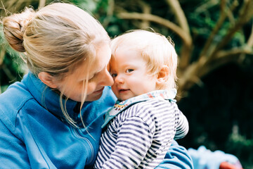 Happy mother holding her baby