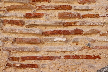 Orange wall made of old bricks. Background, grunge and texture photography. Background for exterior or interior design