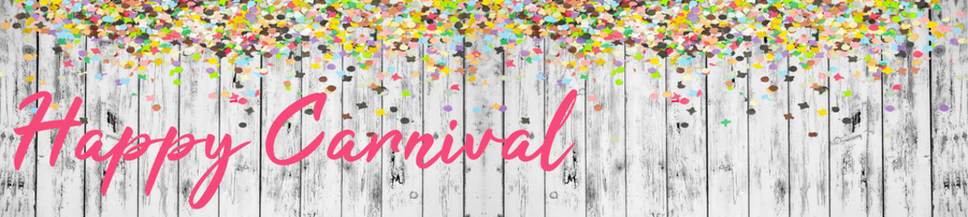 Happy Carnival background panorama banner long - Frame made of colorful confetti isolated on white gray grey painted rustic wooden wall / table boards texture, top view with space for text