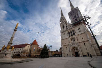 Zagreb / Croatia - December 31 / 2020: Golden angel statues at the square of ZAgreb cathedral