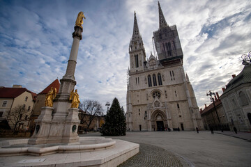 Zagreb / Croatia - December 31 / 2020: Golden angel statues at the square of ZAgreb cathedral