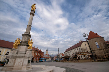 Fototapeta na wymiar Zagreb / Croatia - December 31 / 2020: Golden angel statues at the square of ZAgreb cathedral