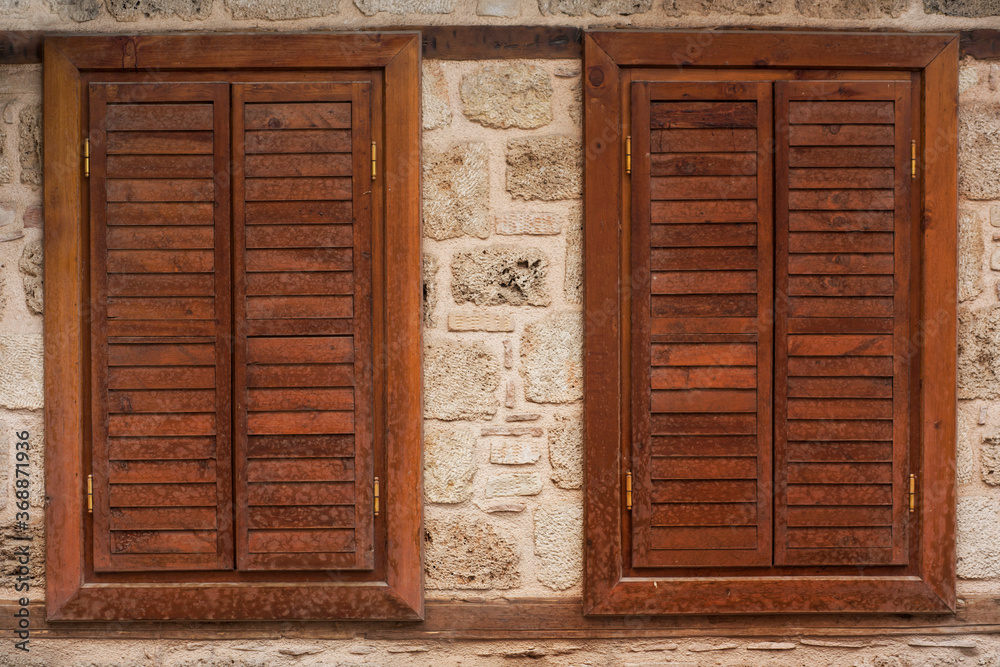 Wall mural closed brown wooden sash on the windows