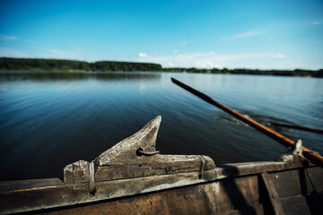 athletes on vacation are engaged in rowing, swimmers on wooden oars hit the water, splashing a lot...