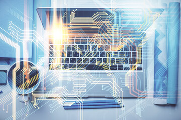 Double exposure of map hologram drawing over study table background with computer. Concept of international network. Top view.