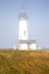 Fototapeta na wymiar Yaquina Head Lighthouse in the fog, Newport, Oregon