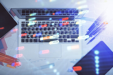 Multi exposure of data drawing hologram over topview of study desk background with computer. Concept of technology.