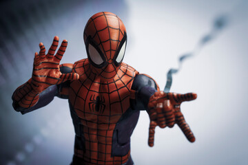 Naklejka premium NEW YORK USA - AUGUST 2 2020: Scene with Marvel comic superhero Spiderman shooting a web - Hasbro Marvel Legends figure